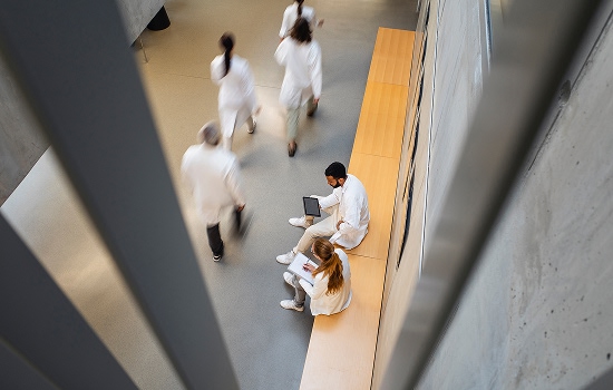 Two people sat discussing technical support.