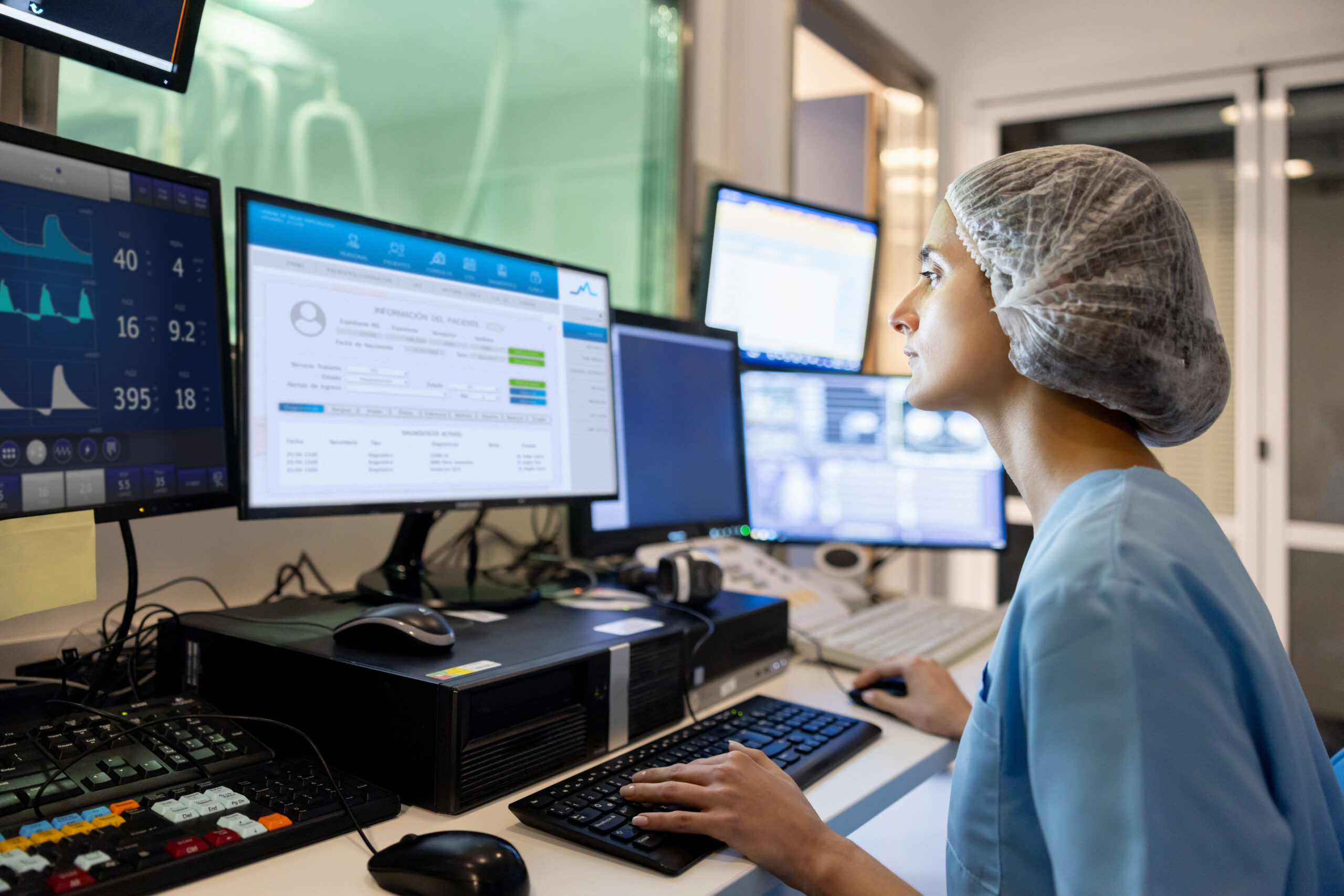 Female doctor reviewing notes on a computer
