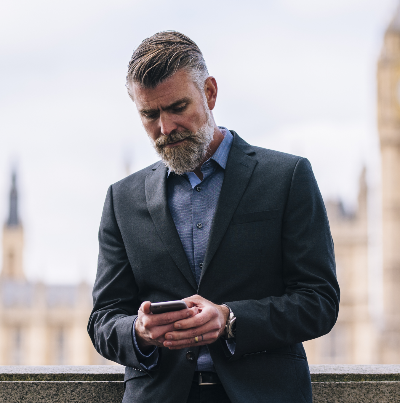 Business man looking at his at phone